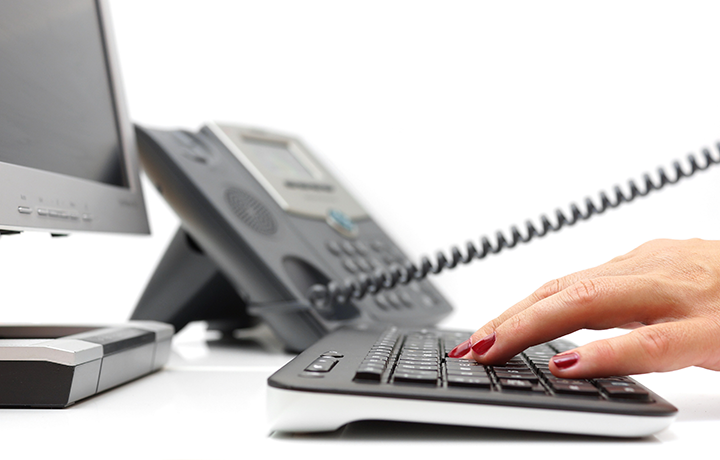 Desktop with Keyboard and Telephone